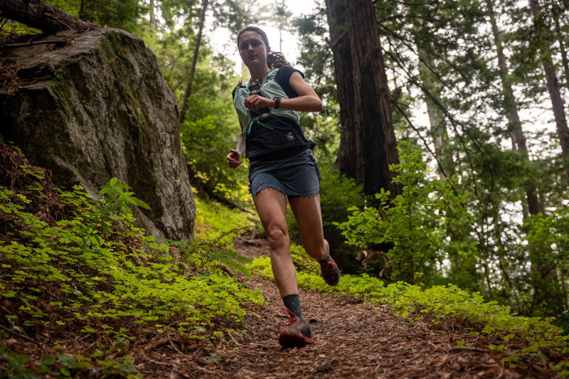 running-vest-woman-running-on-trail